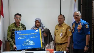 Penyaluran Manfaat TASPEN Bagi Ahli Waris Petugas Damkar DKI Jakarta yang Gugur